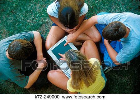 Stock Image - teens with laptop. Fotosearch