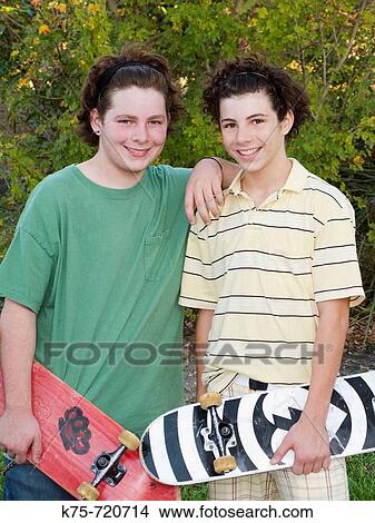 Picture - teens with skateboards. Fotosearch
