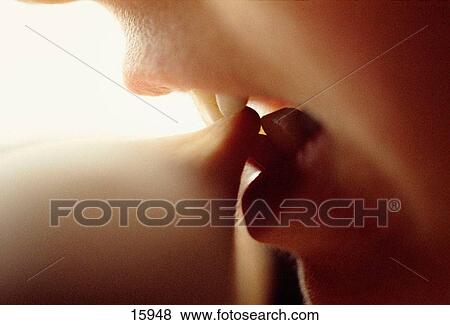 Teeth biting arm View Large Photo Image Stock Photo - Teeth biting arm. Fotosearch