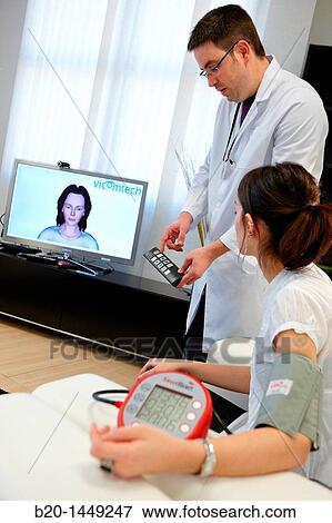 Telemedicine, taking blood pressure in home, Health and Biomedical applications, Vicomtech-IK4 Visual Interaction and Communication Technologies Centre View Large Photo Image Stock Photo - Telemedicine, taking blood pressure in home, Health and Biomedical applications, Vicomtech-IK4 Visual Interaction and Communication Technologies Centre. Fotosearch