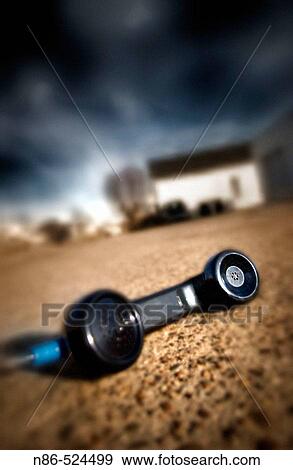 Stock Photo - Telephone laying on ground. Fotosearch