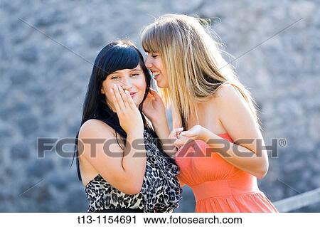 Telling a secret View Large Photo Image Stock Image - Telling a secret. Fotosearch