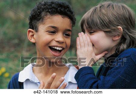 Telling a secret View Large Photo Image Stock Photo - Telling a secret. Fotosearch