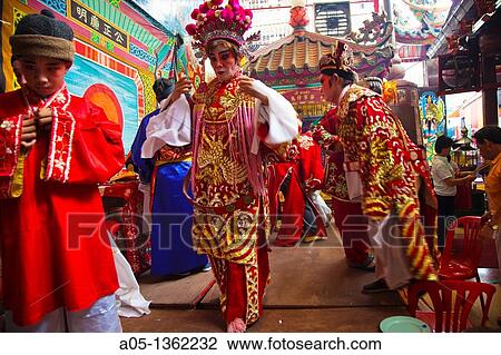 Stock Image - Temple of the Dragon Leng Nuey Yi A play to make an offering Chinatown Bangkok, Thailand, Southeast Asia, Asia.. Fotosearch
