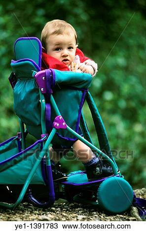 Ten month old baby boy sitting in his stroller, France View Large Photo Image Stock Image - Ten month old baby boy sitting in his stroller, France. Fotosearch