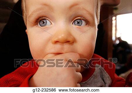 Ten-month old boy sucking thumb View Large Photo Image Stock Photograph - Ten-month old boy sucking thumb. Fotosearch