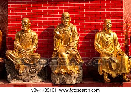 Stock Image - Ten Thousand Buddha's Temple Statues arhats or Buddhist holy men who have reached Nirvana at the base of the Pagoda of the Nine Heavens. Fotosearch