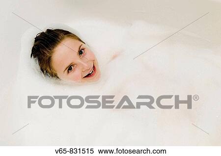 Stock Photography - Ten year old girl in the bath. Fotosearch