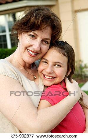 Stock Photo - Tender moment mom and daughter. Fotosearch