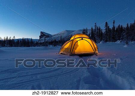 Tent in winter landscape with a shadow of a man View Large Photo Image Stock Photo - Tent in winter landscape with a shadow of a man. Fotosearch
