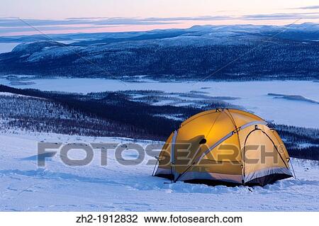 Tent on Mountain with shadow of a man inside View Large Photo Image Stock Image - Tent on Mountain with shadow of a man inside. Fotosearch
