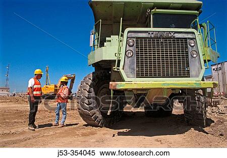 Terex dump truck drivers. I-880 Cypress project. Oakland, California. USA. View Large Photo Image Stock Photography - Terex dump truck drivers. I-880 Cypress project. Oakland, California. USA.. Fotosearch