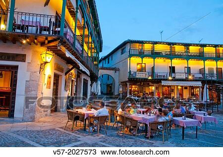 Stock Image - Terraces at the Main Square, night view. Chinchon, Madrid province, Spain.. Fotosearch