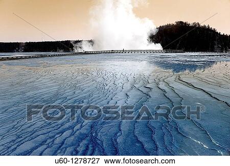 Terraces form from the runoff at Midway Geyser Basin at Yelllowstone National park, Wyoming View Large Photo Image Stock Photo - Terraces form from the runoff at Midway Geyser Basin at Yelllowstone National park, Wyoming. Fotosearch
