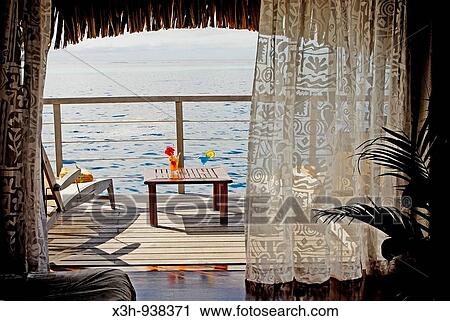 Stock Image - terrasse d? un bungalow sur pilotis, hotel Moorea Pearl Resort sur l? ile Moorea, iles de la Societe, archipel de la Polynesie francaise, ocean pacifique sud. Fotosearch
