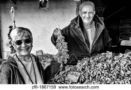 Testour in Tunisia Africa portrait of old Muslim man selling dates to tourist View Large Photo Image Stock Photo - Testour in Tunisia Africa portrait of old Muslim man selling dates to tourist. Fotosearch