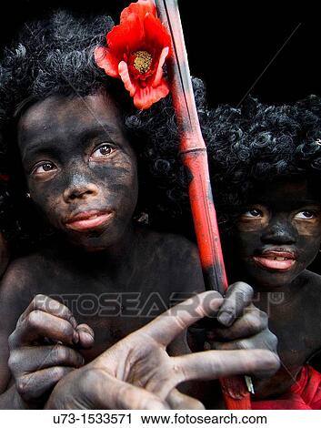 Stock Image - Thai children dressed in Afro style during a colorful festival in Bangkok.. Fotosearch