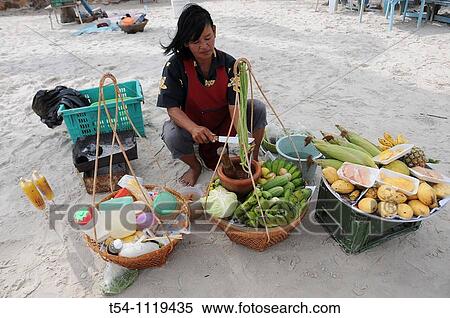 Stock Photography - Thai Woman selling frech Fruits at the Beach in Hua Hin. Fotosearch