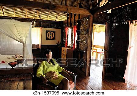Thai young woman, cottage's bedroom, Koh Jum Lodge, Koh Jum Island, Krabi, Thailand, Asia View Large Photo Image Stock Photography - Thai young woman, cottage's bedroom, Koh Jum Lodge, Koh Jum Island, Krabi, Thailand, Asia. Fotosearch