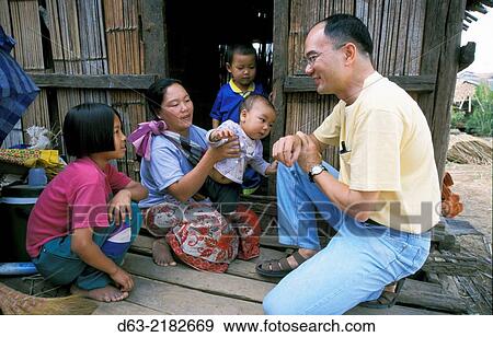 THAILAND. American missionary lay worker at. Lahu tribal village,.Nasiri, near Chiang Mai. View Large Photo Image Stock Photo - THAILAND. American missionary lay worker at. Lahu tribal village,.Nasiri, near Chiang Mai.. Fotosearch