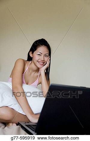 Stock Photo - Thailand. Bangkok. Thai woman.. Fotosearch