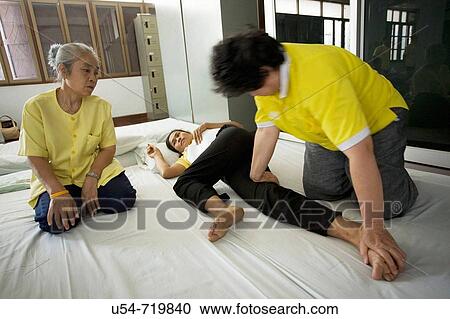 Stock Image - Thailand, Bangkok, traditional massage school. Fotosearch