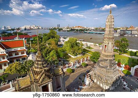 Stock Image - Thailand - Bangkok, Wat Arun Temple Temple of the Dawn, and Chao Phraya river. Fotosearch
