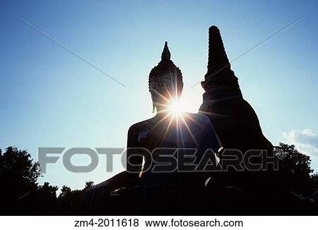 THAILAND, CENTRAL PLAINS, SUKOTHAI, WAT MAHATHAT TEMPLE, 14TH C., SEATED BUDDHA AND CHEDI (STUPA). View Large Photo Image Stock Photo - THAILAND, CENTRAL PLAINS, SUKOTHAI, WAT MAHATHAT TEMPLE, 14TH C., SEATED BUDDHA AND CHEDI (STUPA).. Fotosearch