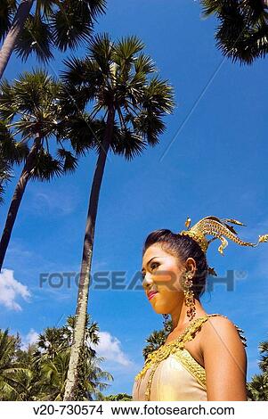 Picture - Thailand, Phuket, Girl in traditional Thai clothes. Fotosearch
