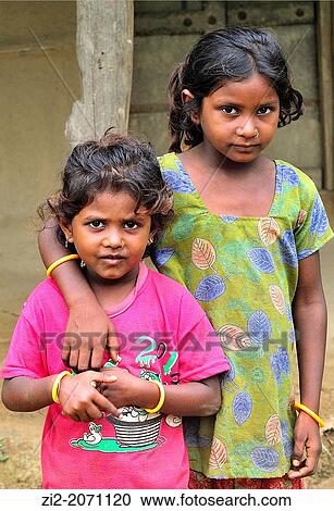 Stock Image - Tharu young girls, Chitwan National Park, Nepal. Fotosearch