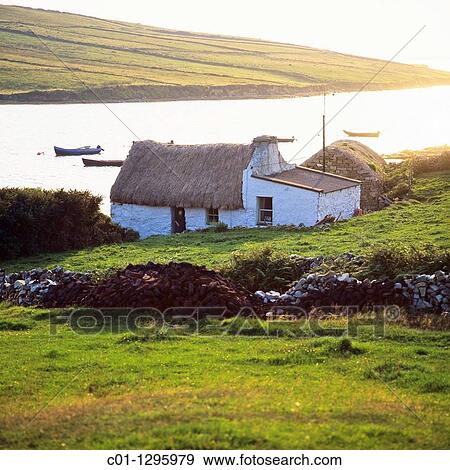 Thatched cottage, Clifden bay, Connemara, county Galway, Ireland View Large Photo Image Stock Photo - Thatched cottage, Clifden bay, Connemara, county Galway, Ireland. Fotosearch