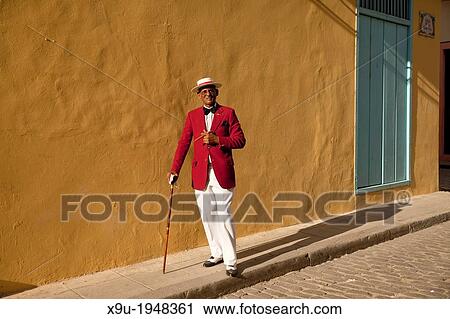 the actor Pedro Pablo Perez with red suit, hat and cigar in Havana, Cuba, Caribbean. View Large Photo Image Stock Image - the actor Pedro Pablo Perez with red suit, hat and cigar in Havana, Cuba, Caribbean.. Fotosearch