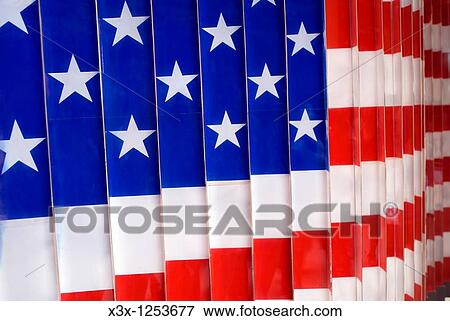 Stock Photo - The American Flag in the immigration museum of Ellis Island NYC USA. Fotosearch