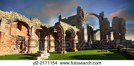 The Anglo Saxon Romanesque Abbey ruins of Holy Island, Lindisfarne, Northumbria, England. View Large Photo Image Picture - The Anglo Saxon Romanesque Abbey ruins of Holy Island, Lindisfarne, Northumbria, England.. Fotosearch