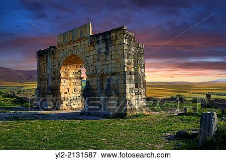 The Arch of Caracalla, built in 217 by the city's governor, Marcus Aurelius Sebastenus, to honour the emperor Caracalla and his mother Julia Domna. Volubilis Archaeological Site, near Meknes, Morocco. View Large Photo Image Stock Photo - The Arch of Caracalla, built in 217 by the city's governor, Marcus Aurelius Sebastenus, to honour the emperor Caracalla and his mother Julia Domna. Volubilis Archaeological Site, near Meknes, Morocco.. Fotosearch