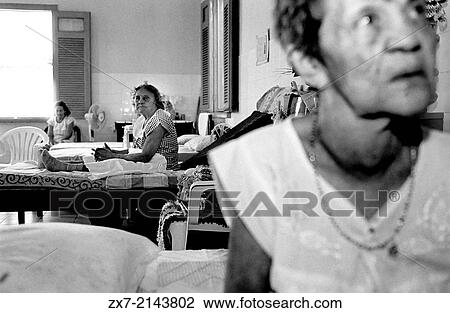 Stock Image - The asylum of the old colony of Maracana (CearB). This woman doesnt know how old is she. She arrived here when she was 20 and loss the notion of the time. ""The girls "" share room and her handmaids decorated it. "". Fotosearch