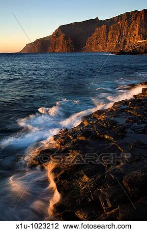 The Atlantic Crashes onto the Volcanic Shore near Los Gigantes Cliffs Tenerife Canary Islands Spain View Large Photo Image Stock Image - The Atlantic Crashes onto the Volcanic Shore near Los Gigantes Cliffs Tenerife Canary Islands Spain. Fotosearch