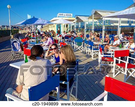 The Bar du Soleil, on the famous Planches, Deauville, Calvados, France. View Large Photo Image Stock Photo - The Bar du Soleil, on the famous Planches, Deauville, Calvados, France.. Fotosearch