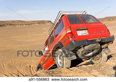 Stock Image - The Black desert (basaltic rocks and sand). Oasis of Bahariya. Egypt. Fotosearch