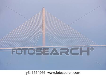 The Bob Graham Sunshine Skyway Bridge, spanning Tampa Bay, partially hidden by fog as viewed from Fort Desoto Park, Tierra Verde, Florida, USA View Large Photo Image Stock Photograph - The Bob Graham Sunshine Skyway Bridge, spanning Tampa Bay, partially hidden by fog as viewed from Fort Desoto Park, Tierra Verde, Florida, USA. Fotosearch