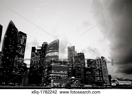 Stock Image - The Central Business District skyline at dusk in Singapore. Fotosearch