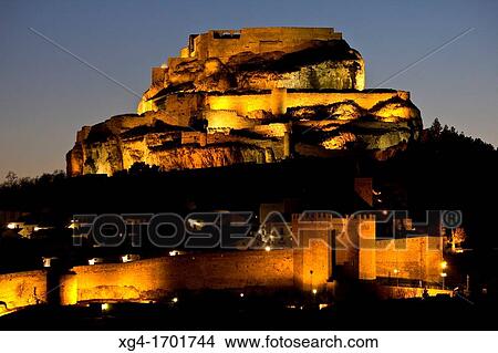 The city of Morella with the walls and the castle lit at sunset Morella Els Ports - Castellon province Comunidad Valenciana Spain - Europe View Large Photo Image Picture - The city of Morella with the walls and the castle lit at sunset Morella Els Ports - Castellon province Comunidad Valenciana Spain - Europe. Fotosearch