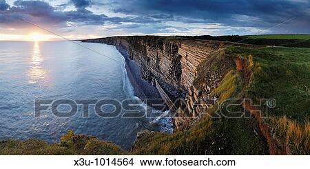 The cliffs of Nash Point on the Glamorgan Heritage Coast in South Wales at sunset View Large Photo Image Picture - The cliffs of Nash Point on the Glamorgan Heritage Coast in South Wales at sunset. Fotosearch