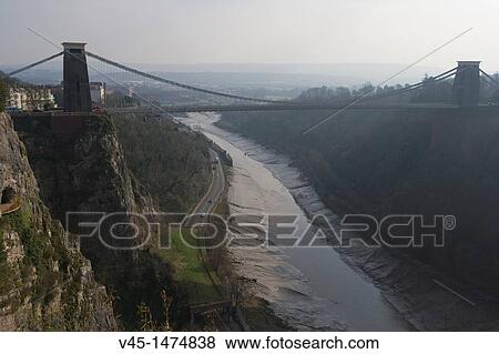 The Clifton Suspension Bridge spanning the Avon Gorge by Isambard Kingdom Brunel, Bristol, Gloucestershire, England, UK View Large Photo Image Stock Photo - The Clifton Suspension Bridge spanning the Avon Gorge by Isambard Kingdom Brunel, Bristol, Gloucestershire, England, UK. Fotosearch