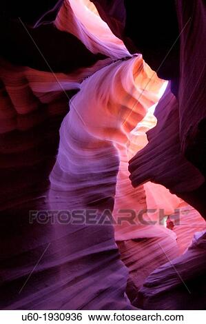Stock Photograph - The colorful fluted walls of Lower Antelope Canyon formed through millions of years of erosion.. Fotosearch