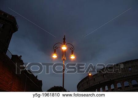 Stock Image - the colosseum at night in rome italy.. Fotosearch