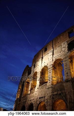 Stock Image - the colosseum at night in rome italy.. Fotosearch