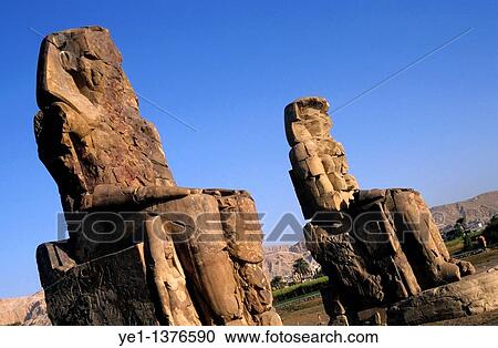 The Colossi of Memnon, two massive stone statues of Pharaoh Amenhotep III, in the Theban necropolis, Luxor, Egypt View Large Photo Image Stock Image - The Colossi of Memnon, two massive stone statues of Pharaoh Amenhotep III, in the Theban necropolis, Luxor, Egypt. Fotosearch