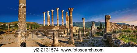 Picture - The Corintian columns of Capitoline Temple dedicated to the three chief divinities of the Roman state, Jupiter, Juno and Minerva. Volubilis Archaeological Site, near Meknes, Morocco.. Fotosearch