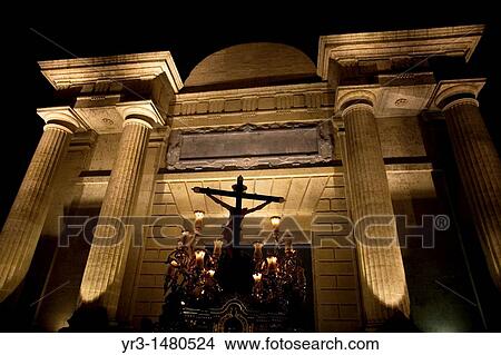 Picture - The Cristo del Amor sculpture crosses the Gate of the Roman Bridge, also known as the Arch of the Triumph during an Easter Holy Week procession in Cordoba, Andalusia, Spain, April 17, 2011. Fotosearch
